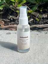 Melanated Beauty Spa Hydrating Rose Water Face Toner spray bottle outdoors