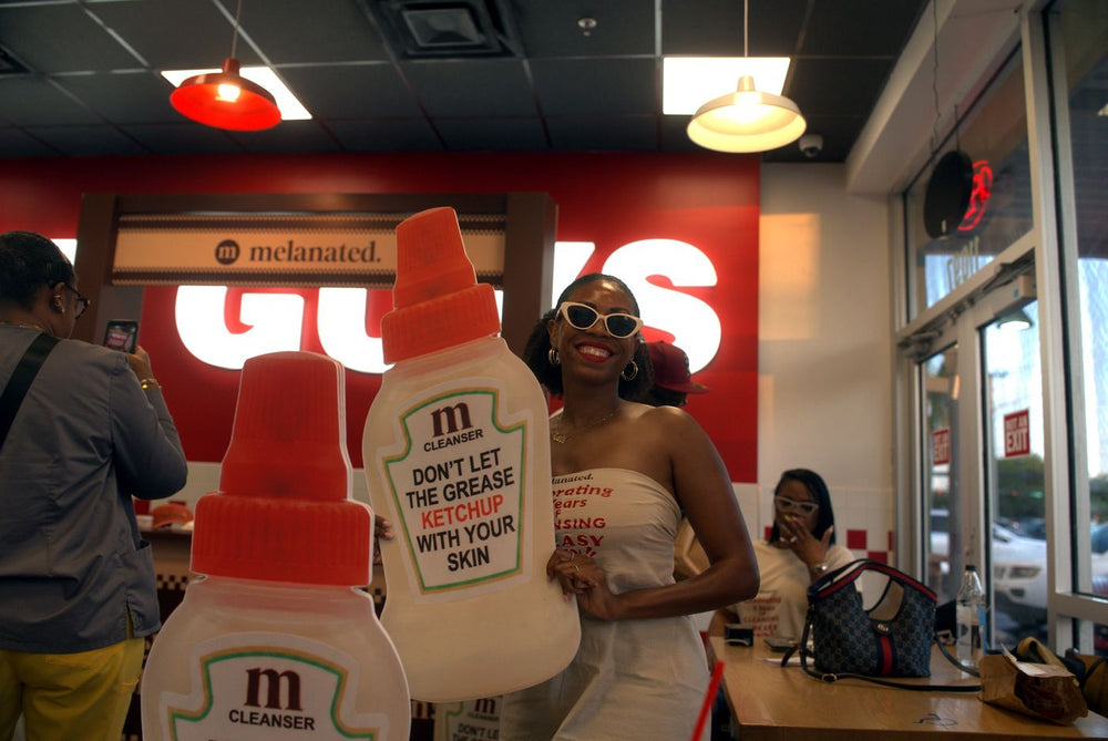 Guest with a giant cleanser bottle
