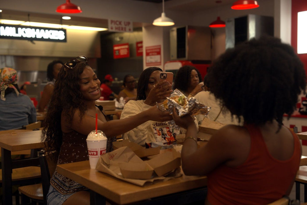 Guests sharing burgers