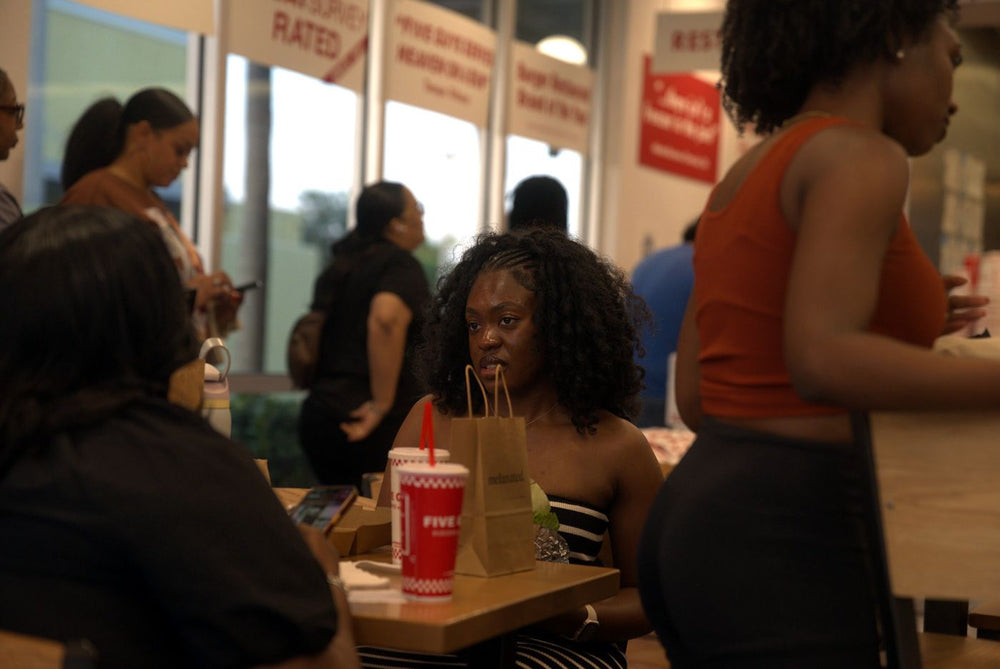 Guests mingling with Melanated gift bags
