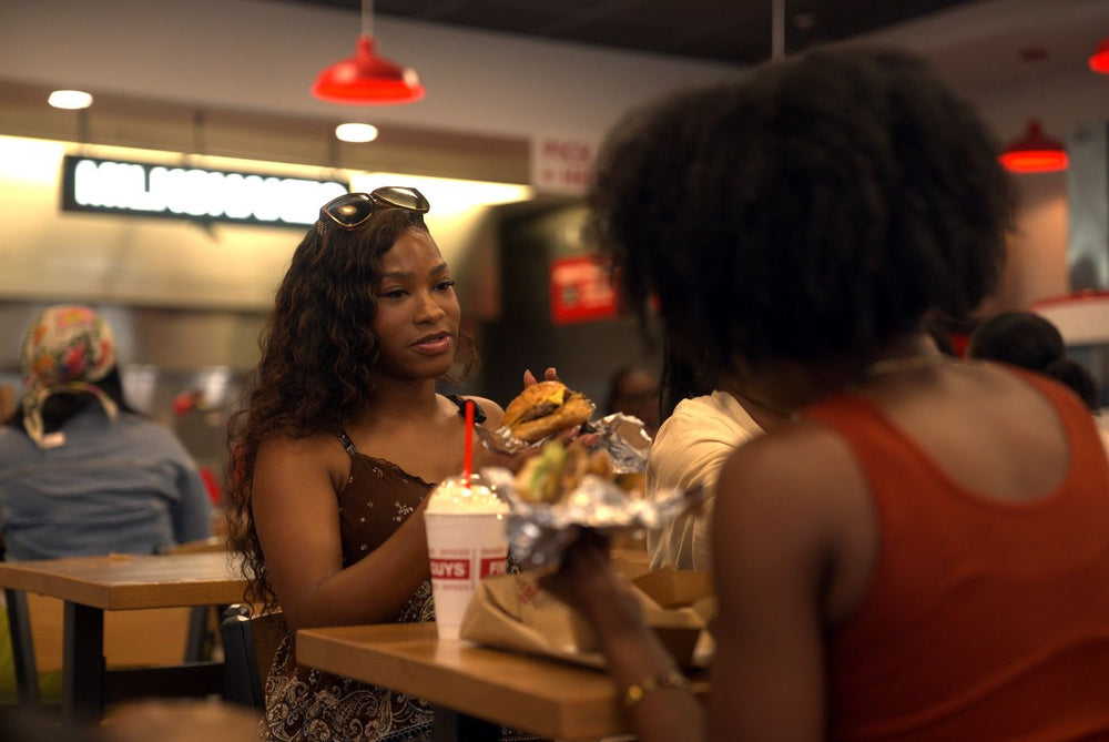 Guest with a burger and a shake