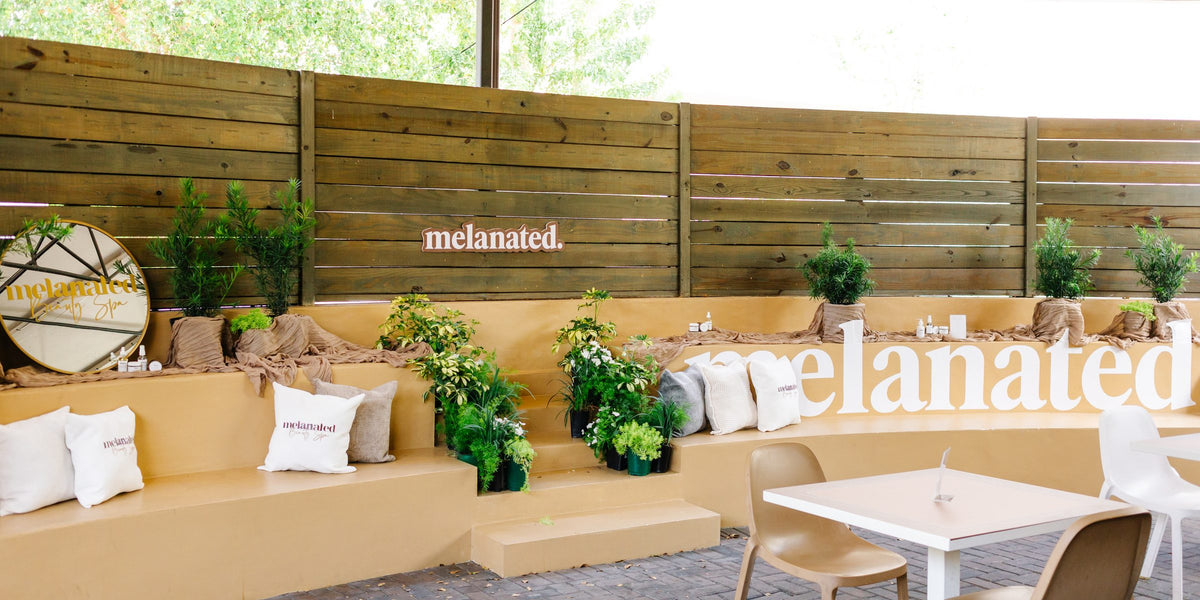 The Melanated Café lounge with the melanated. wordmark