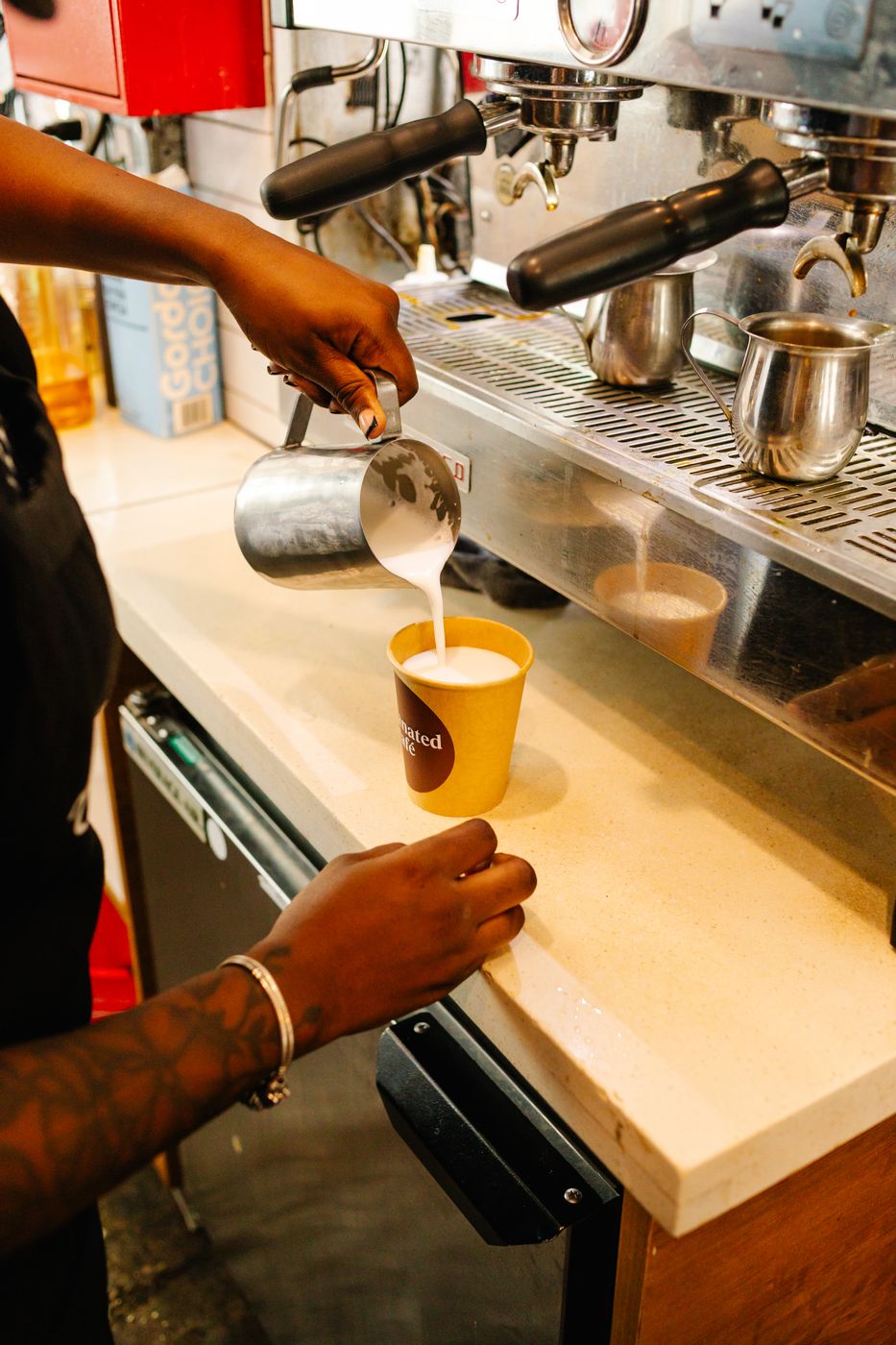 Barista pouring a latte