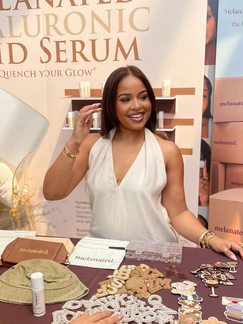 Maghan at the Melanated Hyaluronic Acid Serum booth